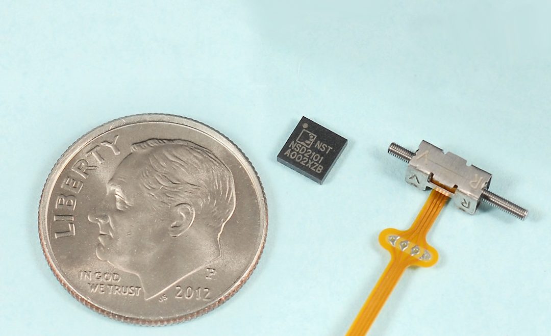 NSD2101 motor drive chip, shown next to a SQUIGGLE piezoelectric motor, incorporates the latest patented drive techniques from New Scale Technologies and ams.