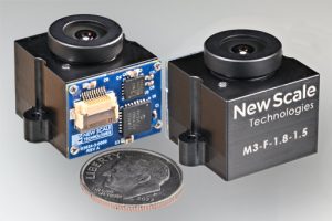 Two New Scale M3-F focus modules showing front and back, with a coin