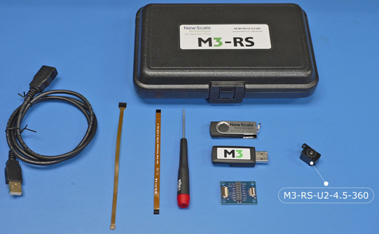 the M3-RS-U2 Dev Kit contents: a black case, a USB cable, flex cables, a screw driver, a break-out board, a USB adapter, a thumb drive with software, and a rotary stage
