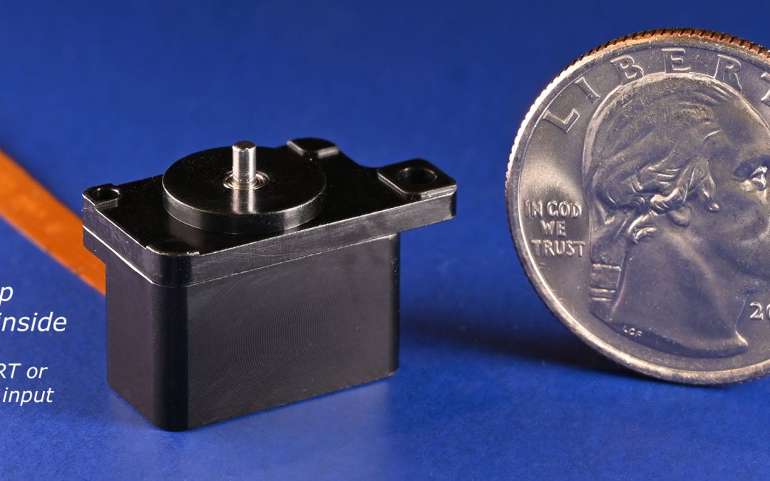 photo of M3-RS-U2 rotary microstage next to a quarter for scale