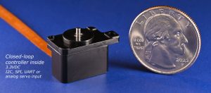 photo of M3-RS-U2 rotary microstage next to a quarter for scale